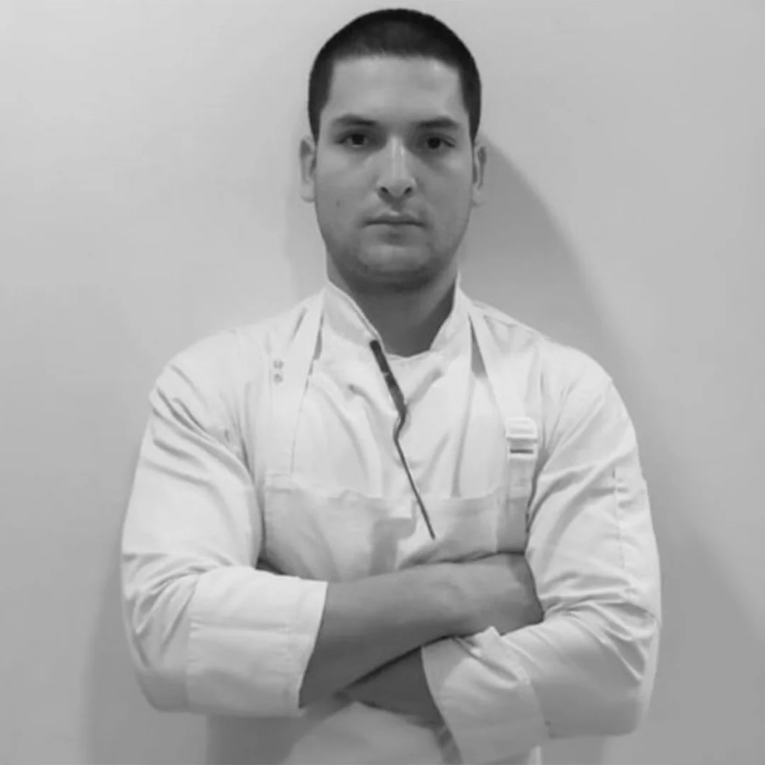 Joel López Giraldo, Chef de Cuisine at Elcielo Washington D.C., in chef whites with arms crossed